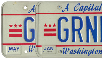 Close-up image of two 1984 base personalized plates in order to show differences in silk-screen printed graphics.