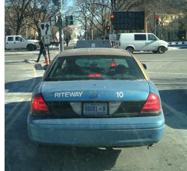 Hire plate no. 00001-H in use on a Ford LTD CRown Victoria