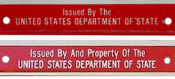 Comparison of U.S. DOS identification legend on early and later embossed 1984 baseplates.