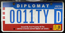 1984 base OFM Diplomat license plate, flat style, no. 0011TYD