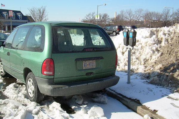 D.C. auto plate no. AX-9721 on a Dodge minivan parked on Water St. SW.