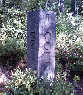 The Conn.-Mass. state line marker alongside the abandoned Conrail line, about one quarter mile north of the Tri-State Marker.