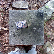 The top of the Connecticut corner marker, with my compass facing north in the Conn. portion.
